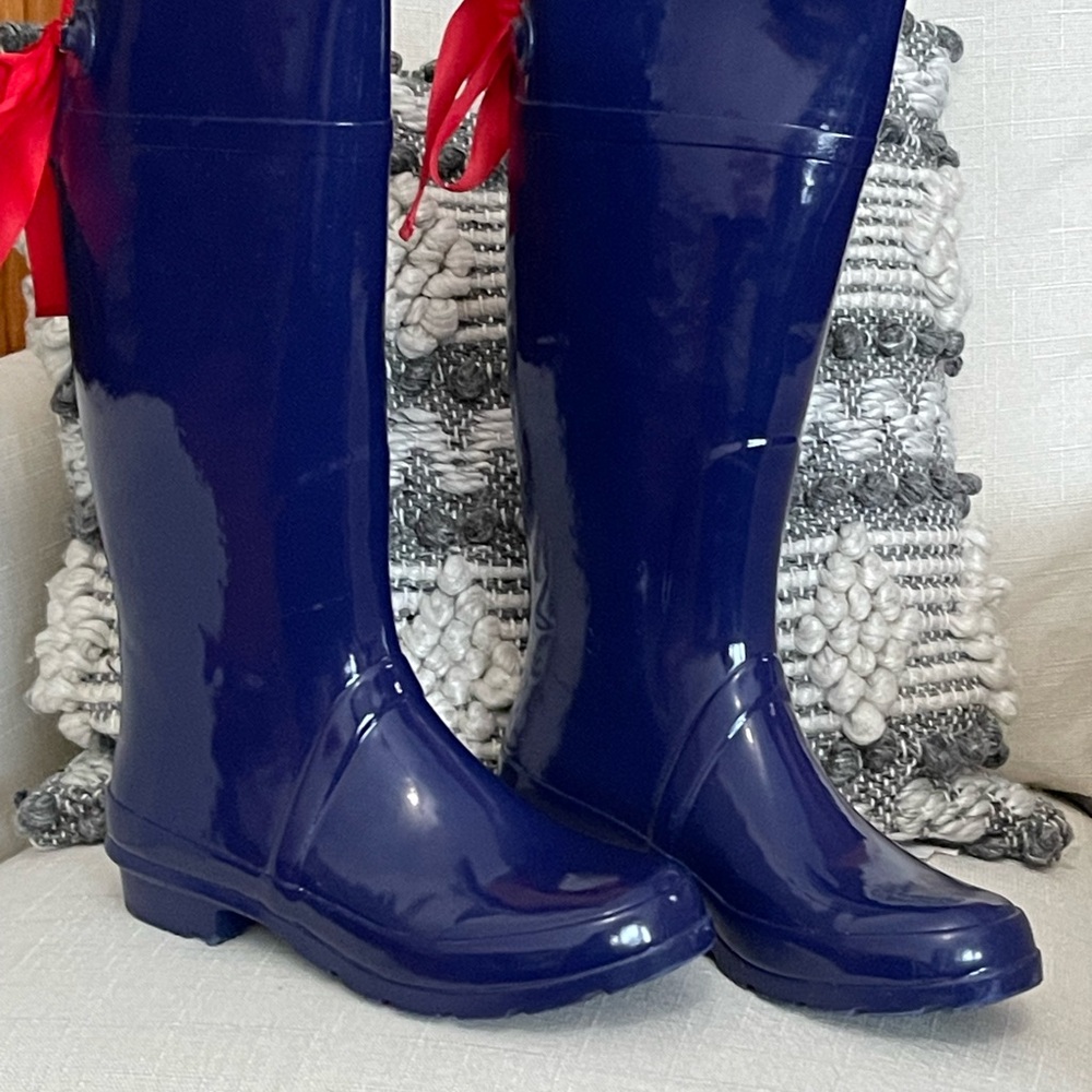 Navy blue w/ red bow Nomad rain boots